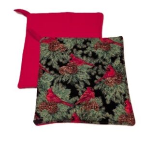 Red Cardinal in Green Fir Bush with Gold Touch on Black Backgroun